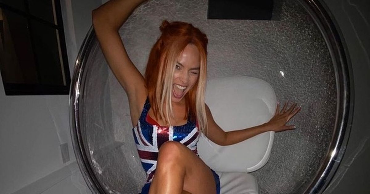 Margot Robbie morphs into Ginger Spice with a Union Jack minidress for Halloween