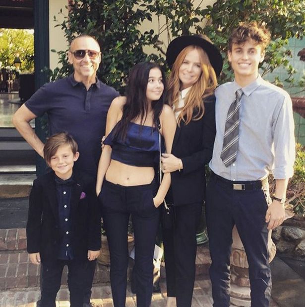 Patsy and her husband pose in LA with their three children