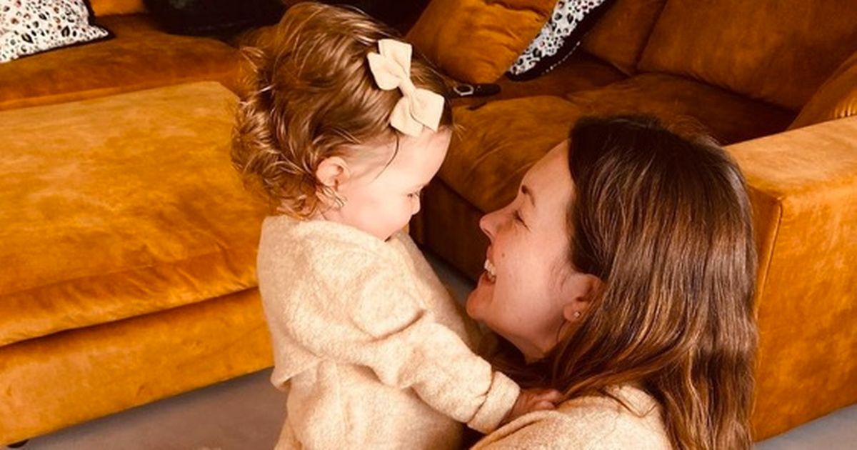 Pregnant Lacey Turner cuddles mini-me daughter Dusty in matching outfits