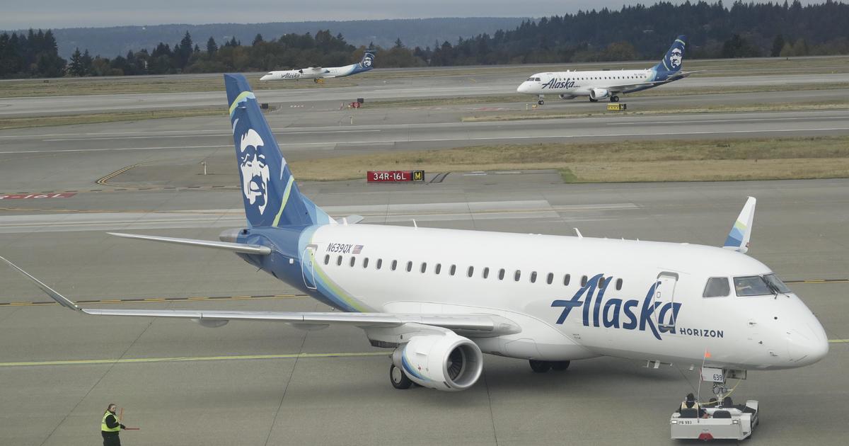 Video shows man walking on wing of plane before takeoff