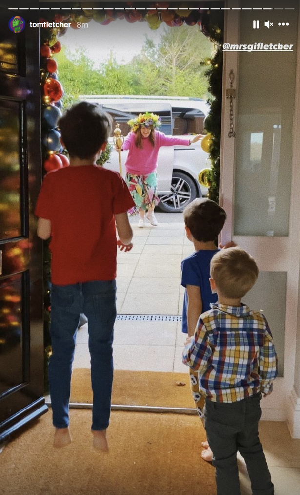 Giovanna ran towards her children as they stood by the doorway