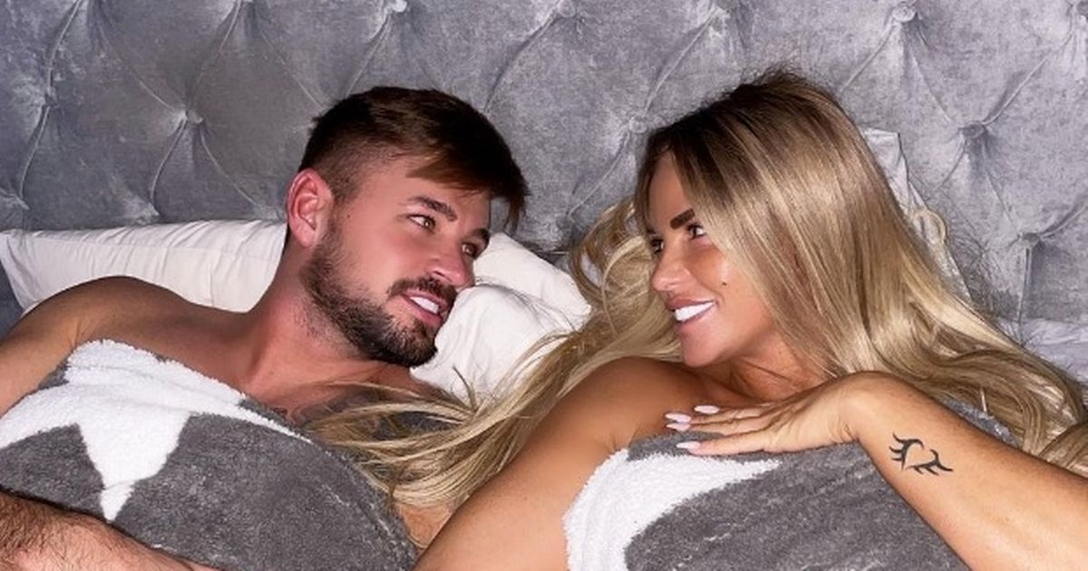 Katie Price strips topless for intimate bed snap as she swoons over Carl Woods