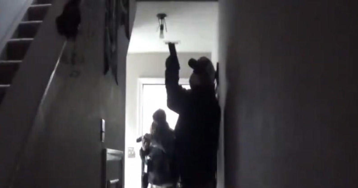 Fired COVID data curator posts video of agents raiding her home