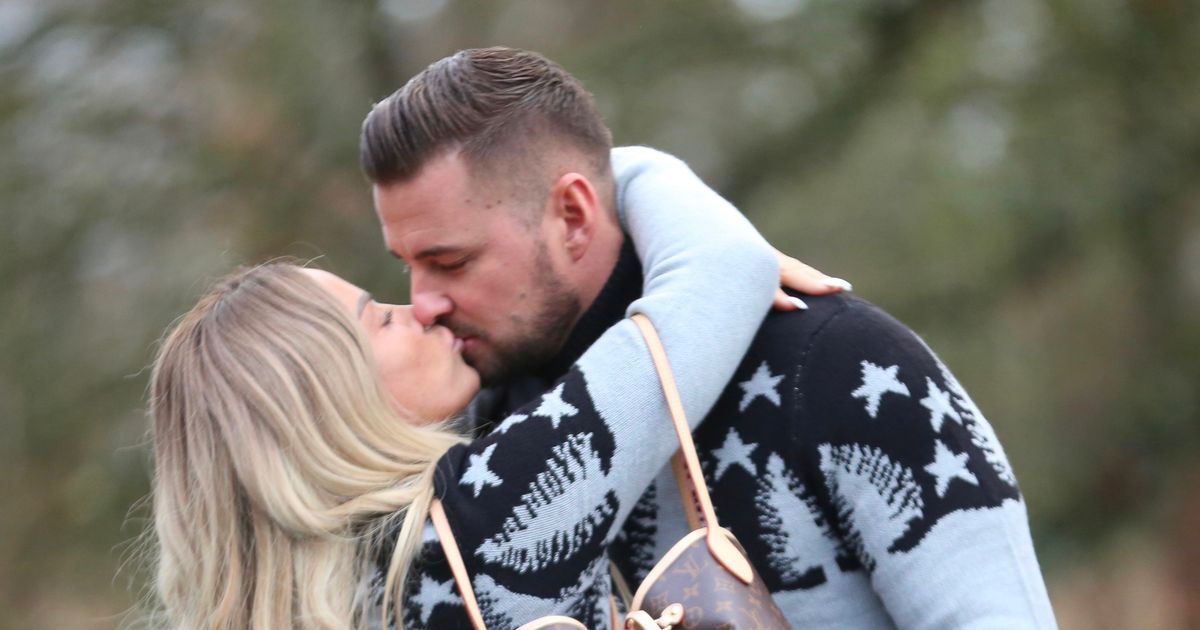 Katie Price and Carl Woods wear matching Xmas jumpers on day out with the kids