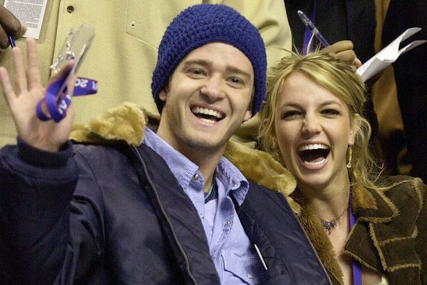 Justin Timberlake and Britney Spears wave to the crowd prior to the start of the 2002 NBA All-Star game in Philadelphia