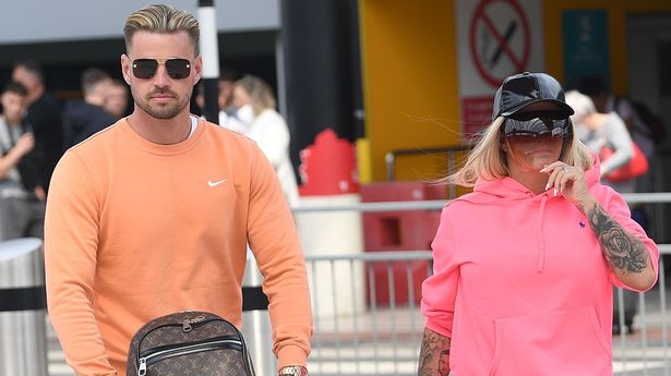 Katie Price and fiancé Carl Woods jet off on holiday after she escapes jail time