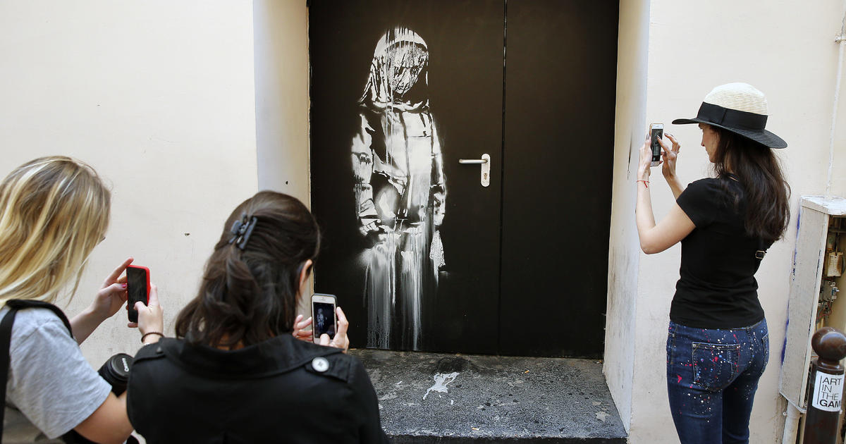 8 on trial over theft of Banksy’s tribute to Paris terror attack victims