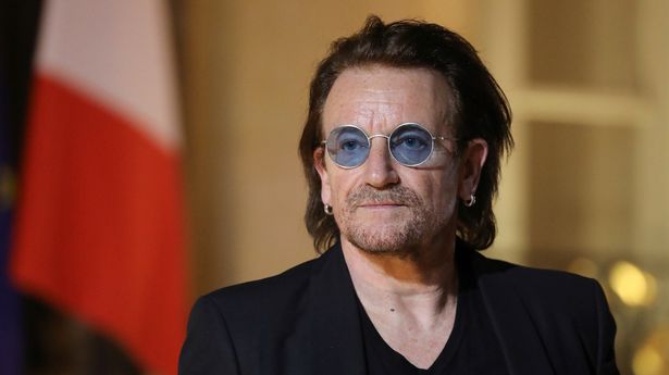 Irish lead singer of rock band U2, Paul David Hewson aka Bono delivers a statement in the courtyard of the Elysee Palace, in Paris, after a meeting with French President, on September 10, 2018