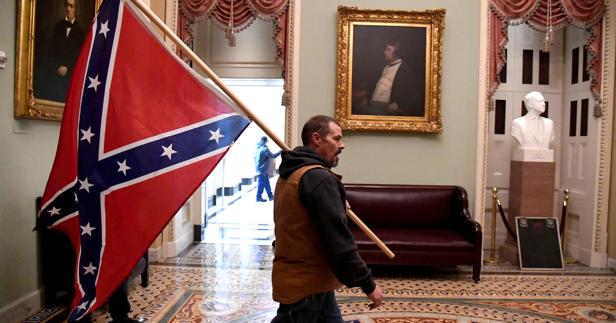 Man seen holding Confederate flag in Capitol riot found guilty