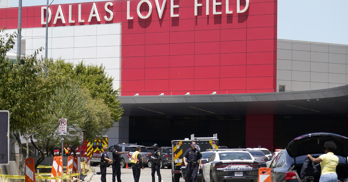 Woman opens fire at Dallas airport, taken into custody, police say