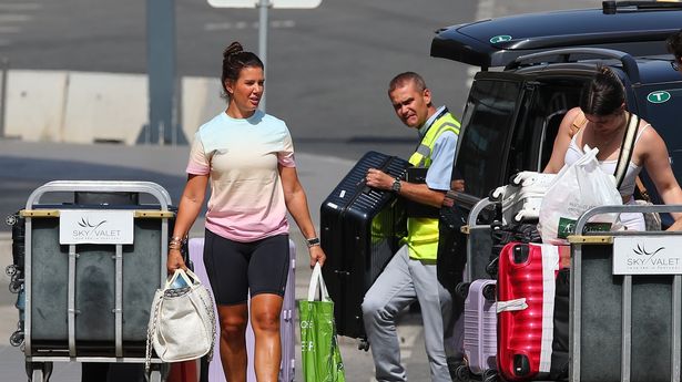 Rebekah Vardy keeps it casual as she's pictured leaving Portugal following holiday