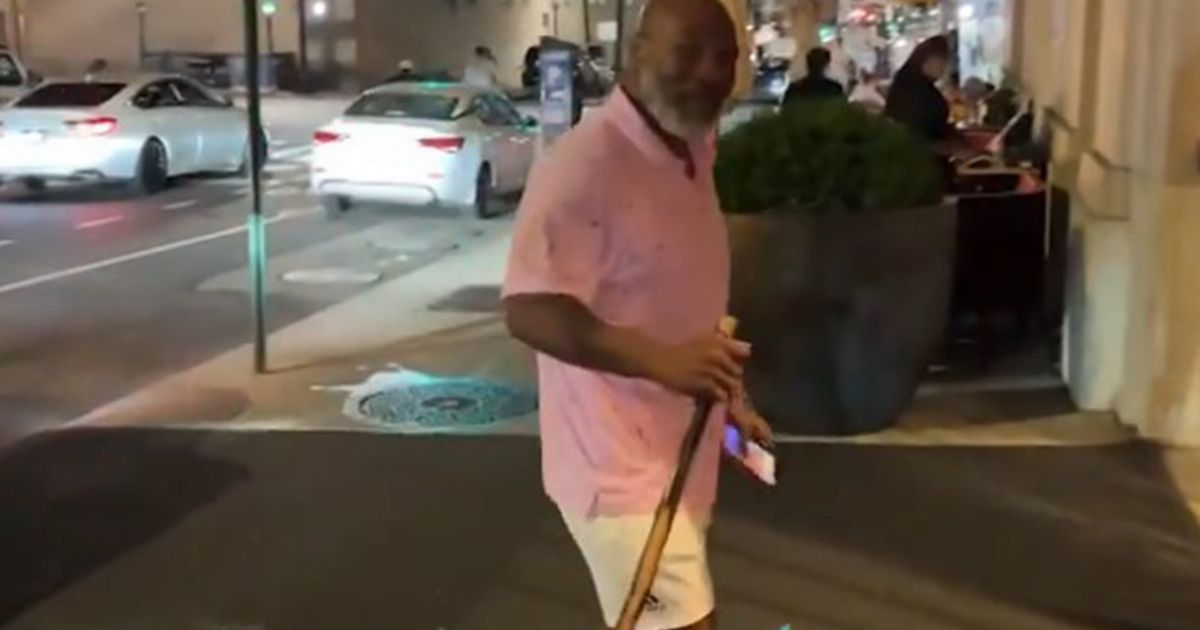 Mike Tyson, 56, pictured using walking stick as he arrives at New York hotel