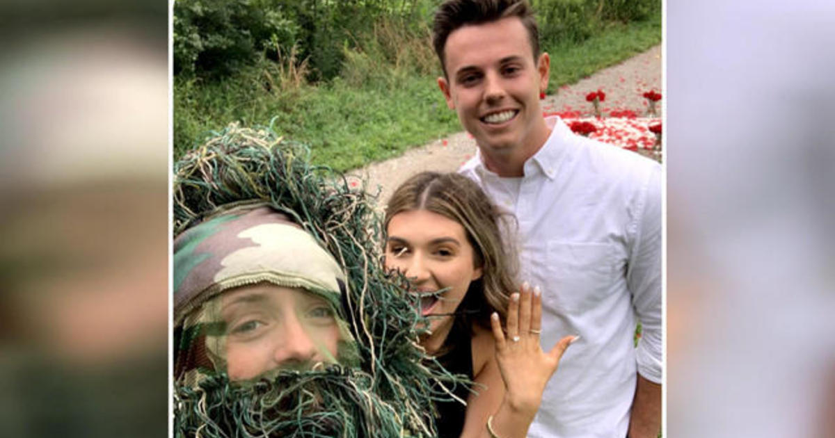 Best friend dresses up as bush to surprise couple with engagement photo shoot