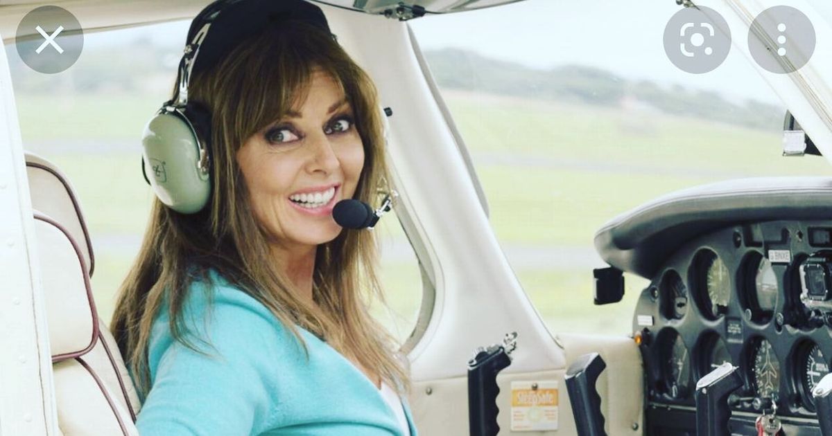 Carol Vorderman beams in the cockpit as she marks 9 years since first solo flight