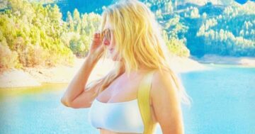 Carol Vorderman flaunts washboard tummy as she channels Bond girl in tight white bikini