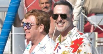 Elton John is a picture of health out of his wheelchair as he holidays with David Furnish